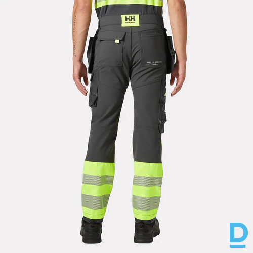 HELLY HANSEN 77471 CONSTRUCTION Darba Bikses ar Nokarenam Kabatām HI VIS 4 Way Stretch Cordura Washable Yellow Black NORWAY Drošības Darba Apģērbi Specapģērbi