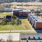 An 836 m² land plot is for sale in a multi-storey residential development zone (