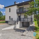 A fully renovated two-storey detached house with a separate outbuilding and a 3,