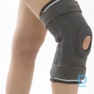 Knee orthosis with flexible side anchorages 105
