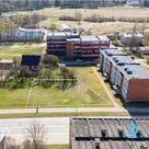 An 836 m² land plot is for sale in a multi-storey residential development zone (
