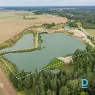 A spacious 64,900 m² land plot with a private lake is for sale in Svēte Parish, 