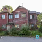 A 268.4 m² wooden residential property with 7 apartments in a green area of Ķeme