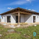 A single-storey house under construction with a 1,740 m² land plot in the "Tango