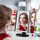 Folding mirror with LED lighting