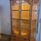 A pine wooden display case with lighting is for sale