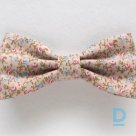 A cotton bow tie with a small flower pattern is for sale