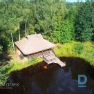 Spacious plot of land with a private lake and a sauna building in Amatciems