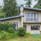 A two-story garden house with a spacious and well-kept area next to the forest i