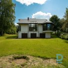 A spacious two-story family house with a sauna building in a picturesque locatio