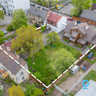 Three buildings are for sale: a wooden building with three rental apartments, a 