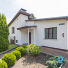 For sale is a two-story house with a scenic, well-kept plot of land and outbuild