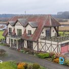 Pamatīga divstāvu savrupmāja, pirts ēka un 35.6 ha zemes gabals ar privātu mežu 