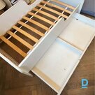 Baby cot with pull-out drawer