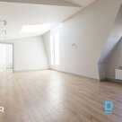 A new 3-room attic apartment is for sale in a renovated building with a view of 